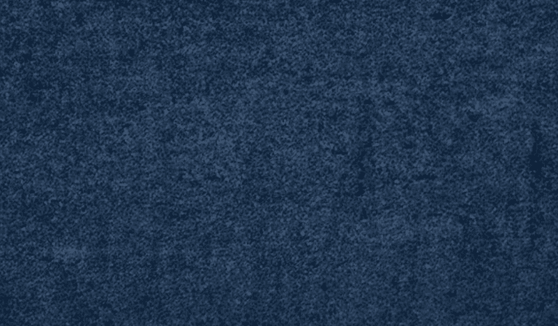 Close-up of dark blue denim fabric texture.