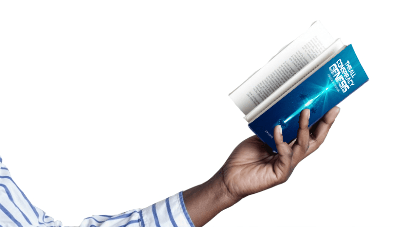 Hand holding a small blue book with a rolled newspaper.